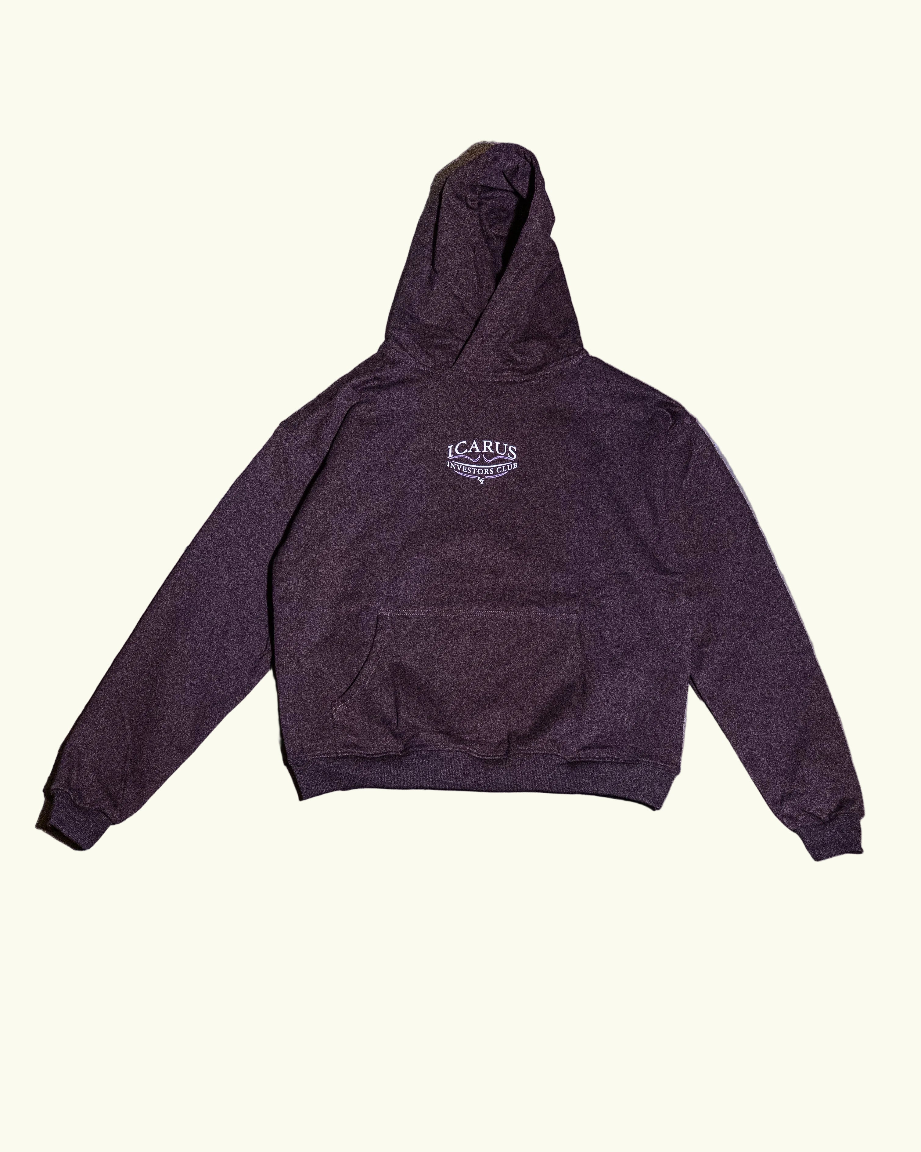 Brown hoodie with a logo on a concrete floor