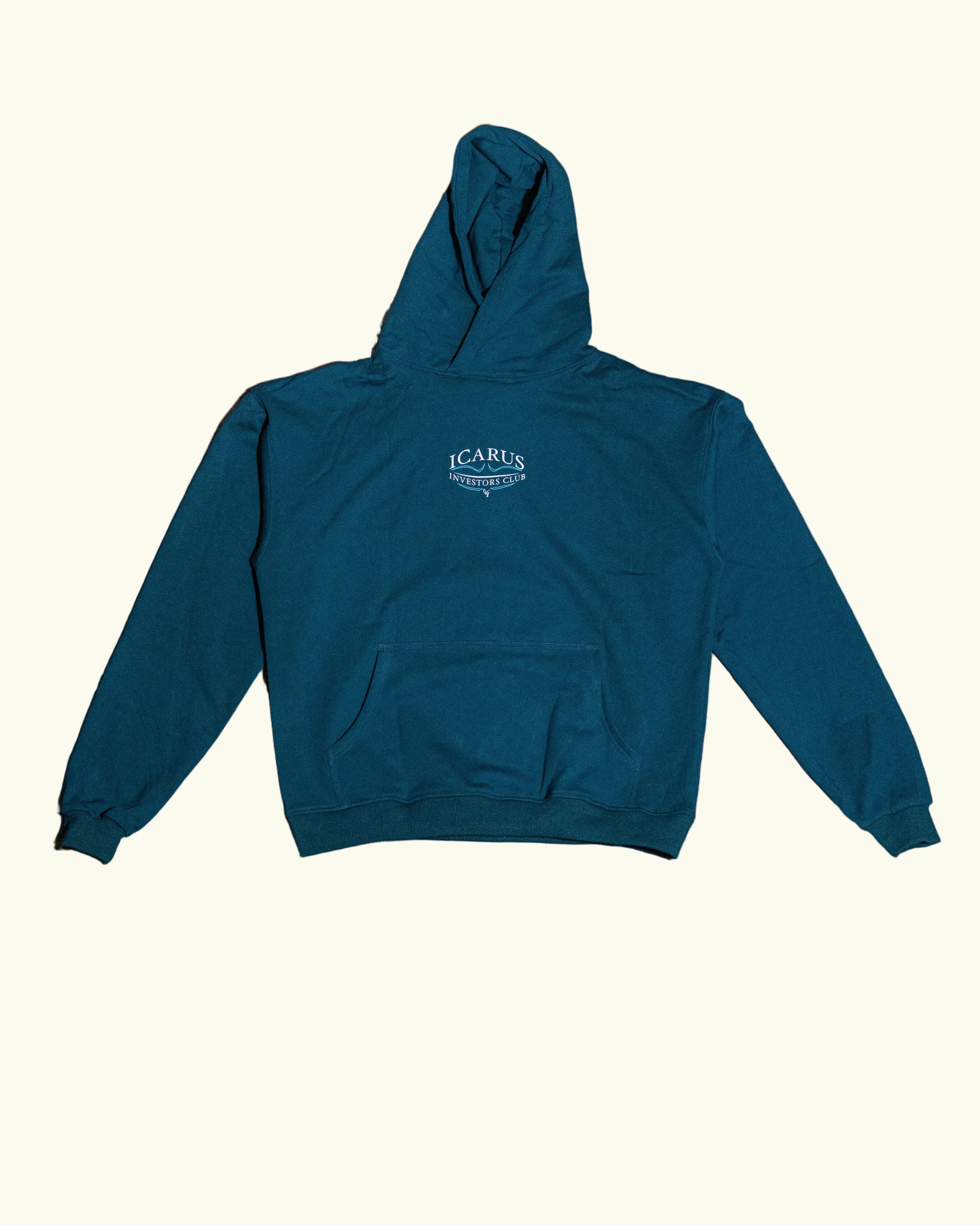 Green hoodie with a brand logo on a concrete floor