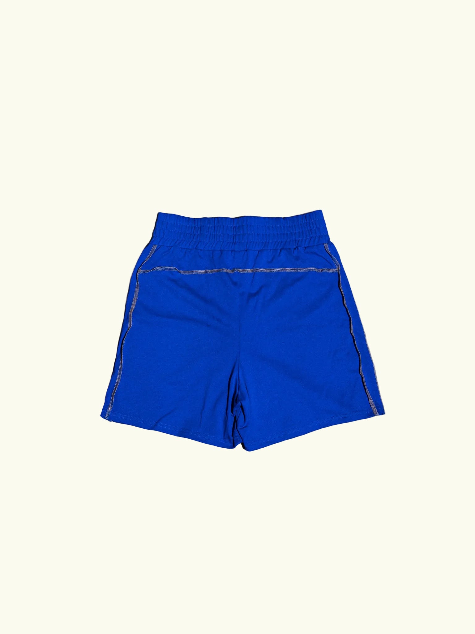 Blue shorts on a concrete floor