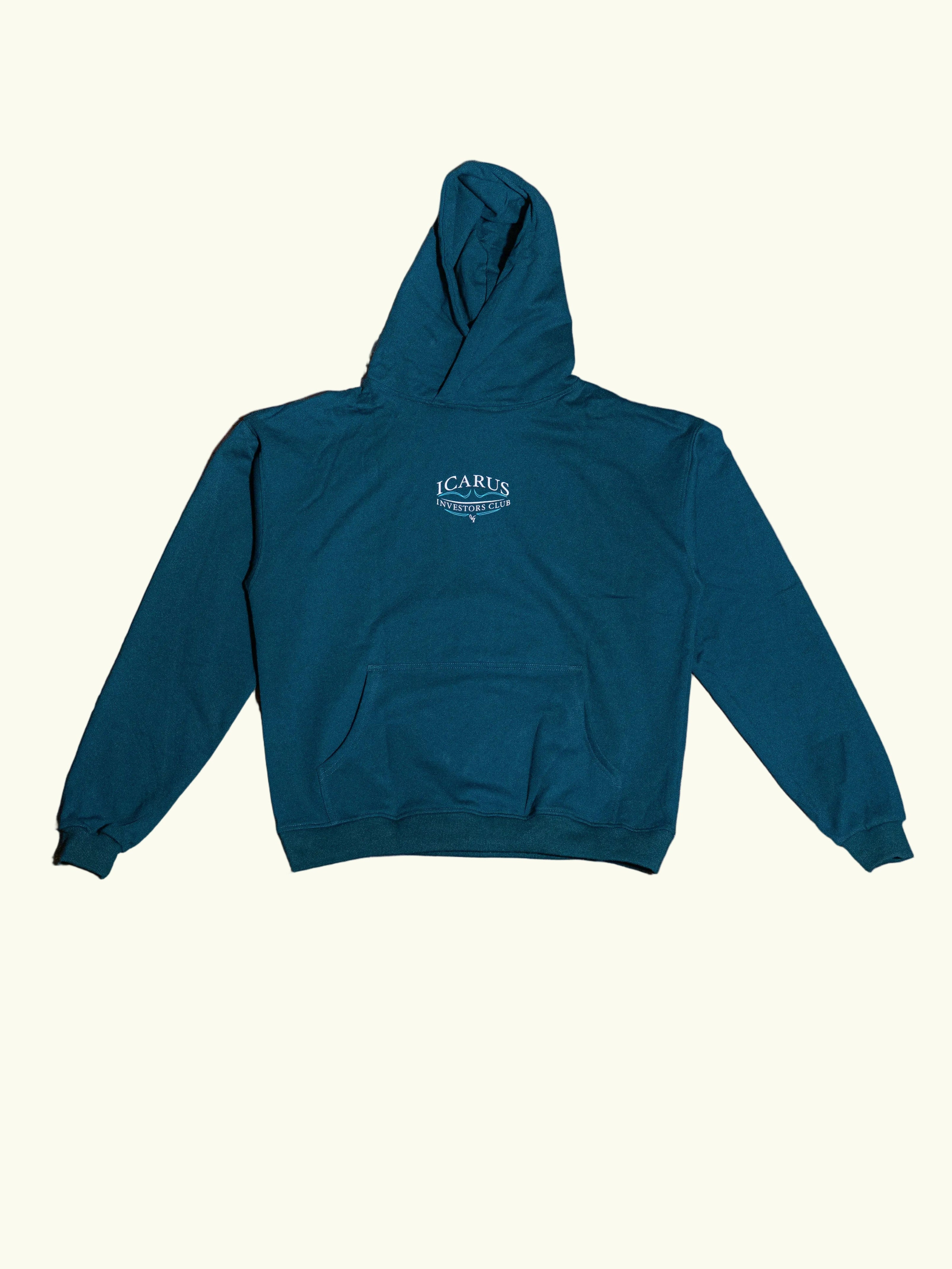 Green hoodie with a brand logo on a concrete floor