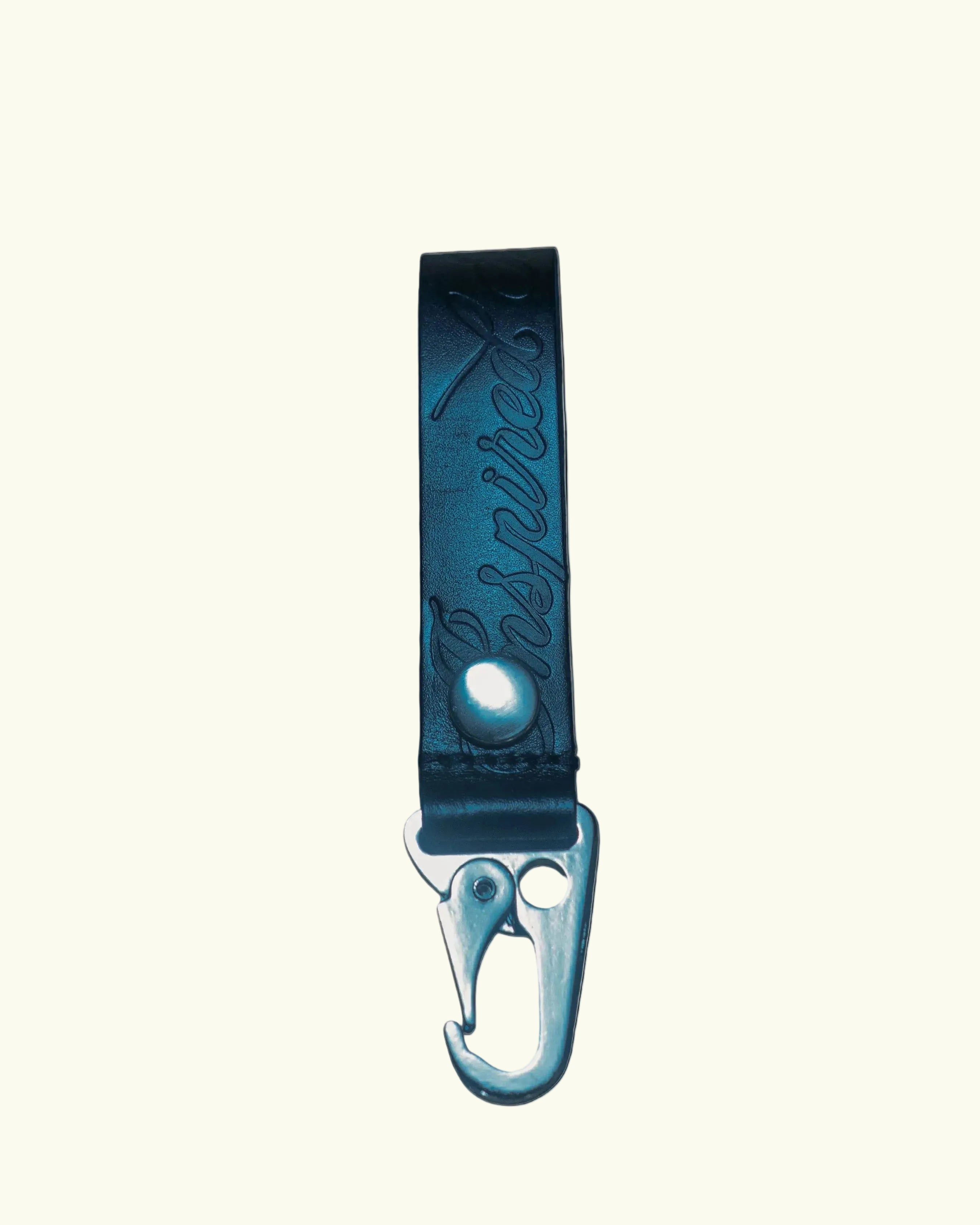 Blue leather keychain with carabiner on a white background